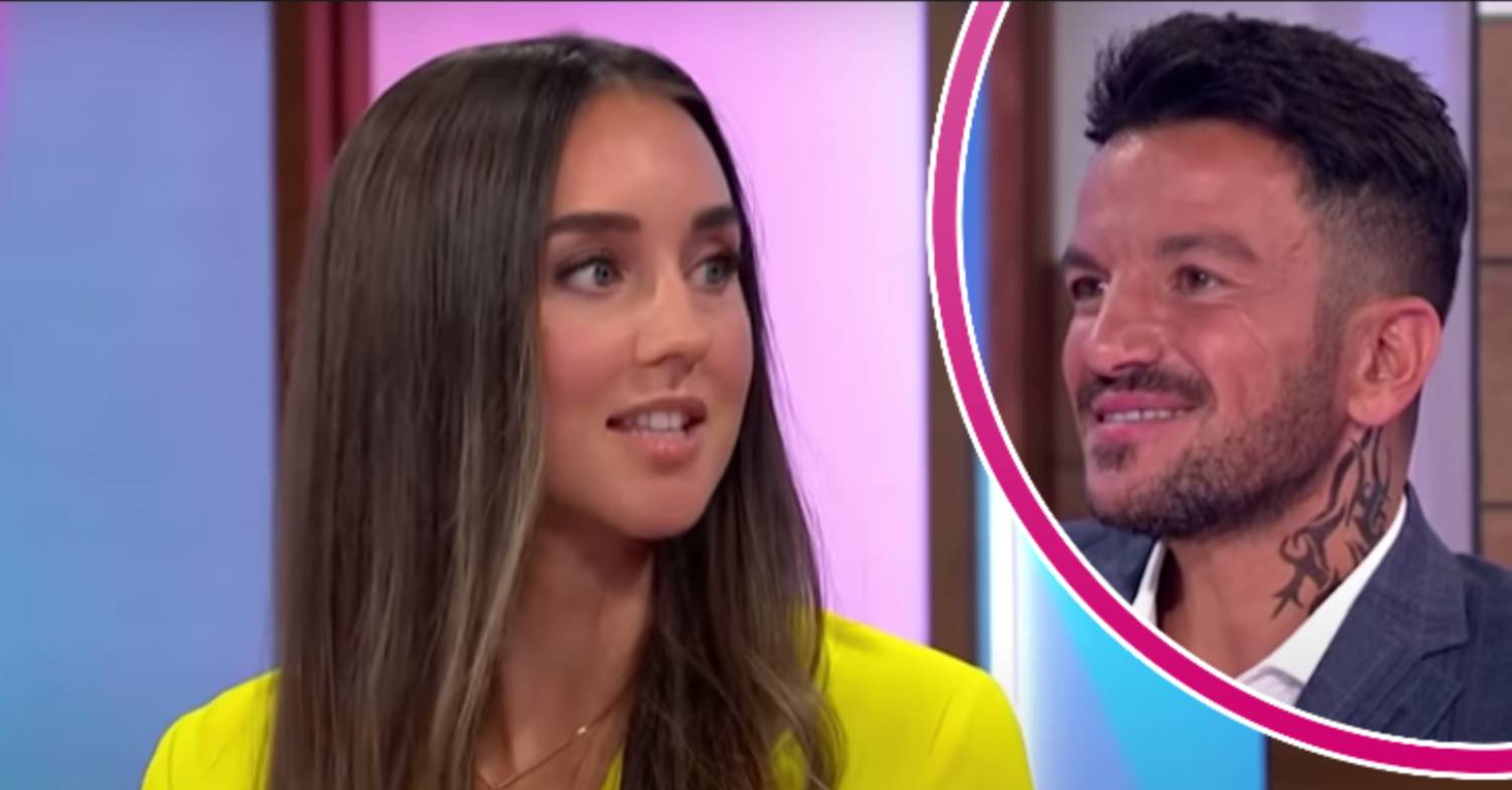 Emily Andre looks to her side, Peter Andre smiles