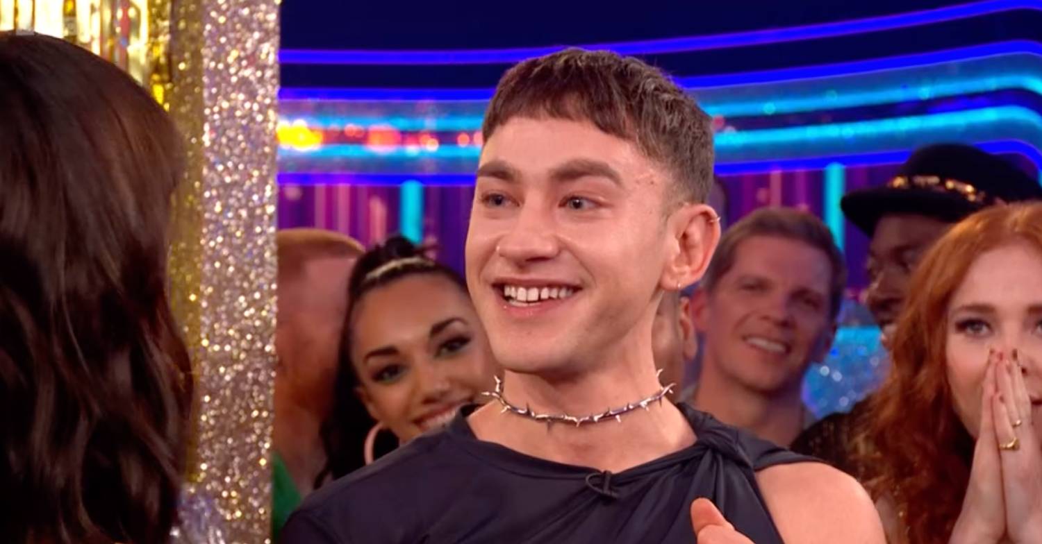 Olly Alexander smiles