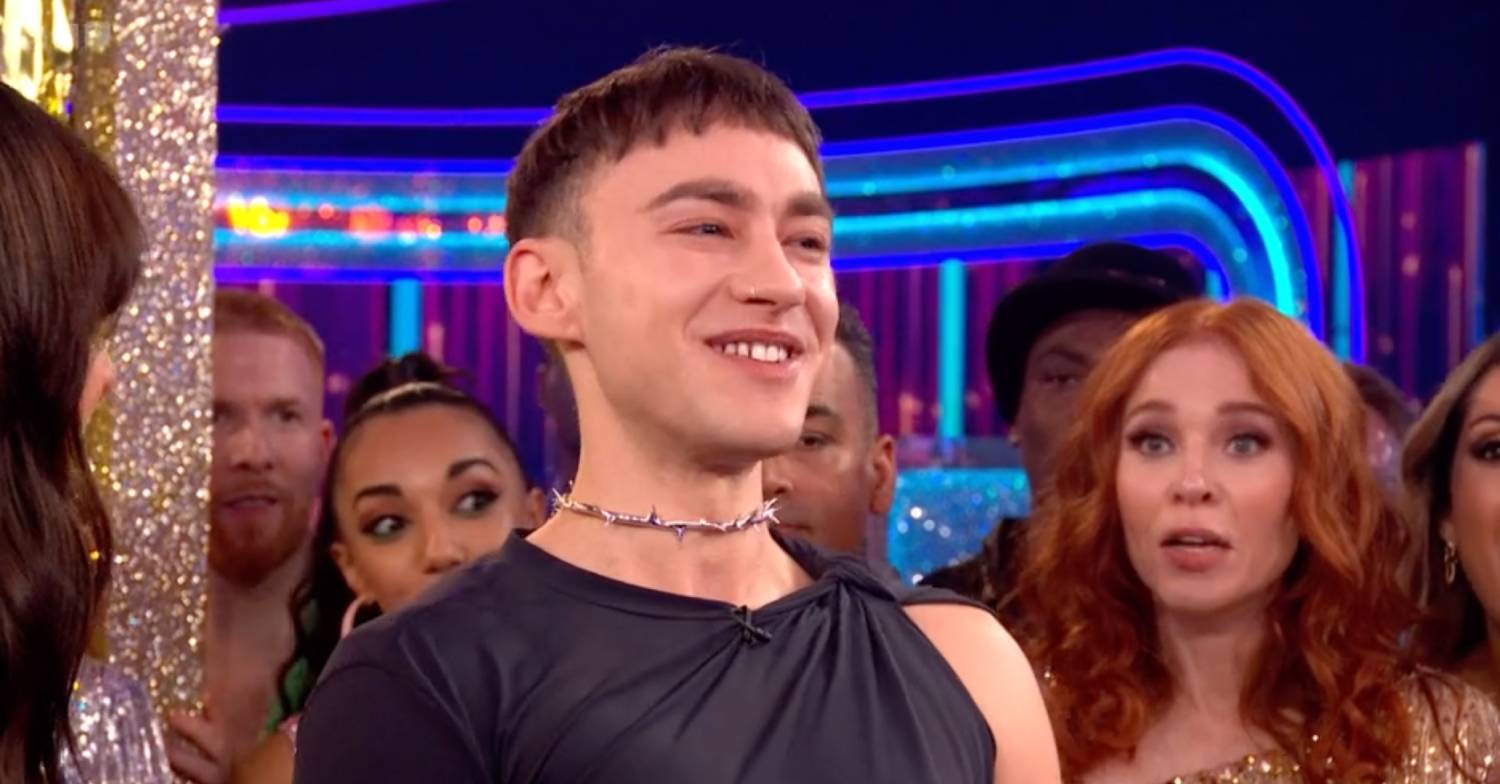 Olly Alexander smiles as he makes his announcement