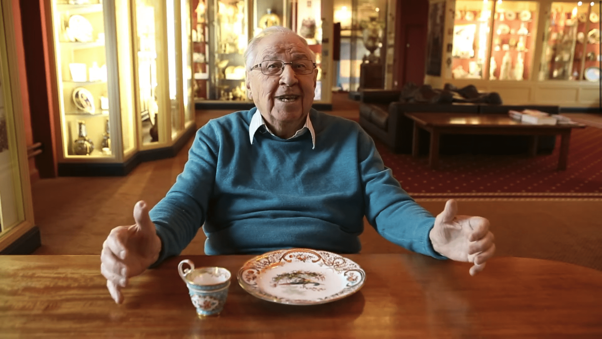 Henry Sandon examining a plate