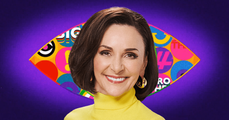 Shirley Ballas smiling in front of the Celebrity Big Brother logo