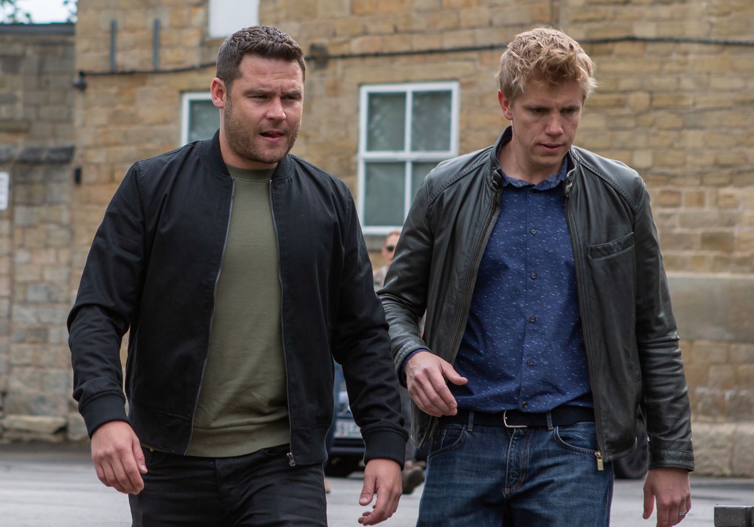 Aaron and Robert look brooding in Emmerdale