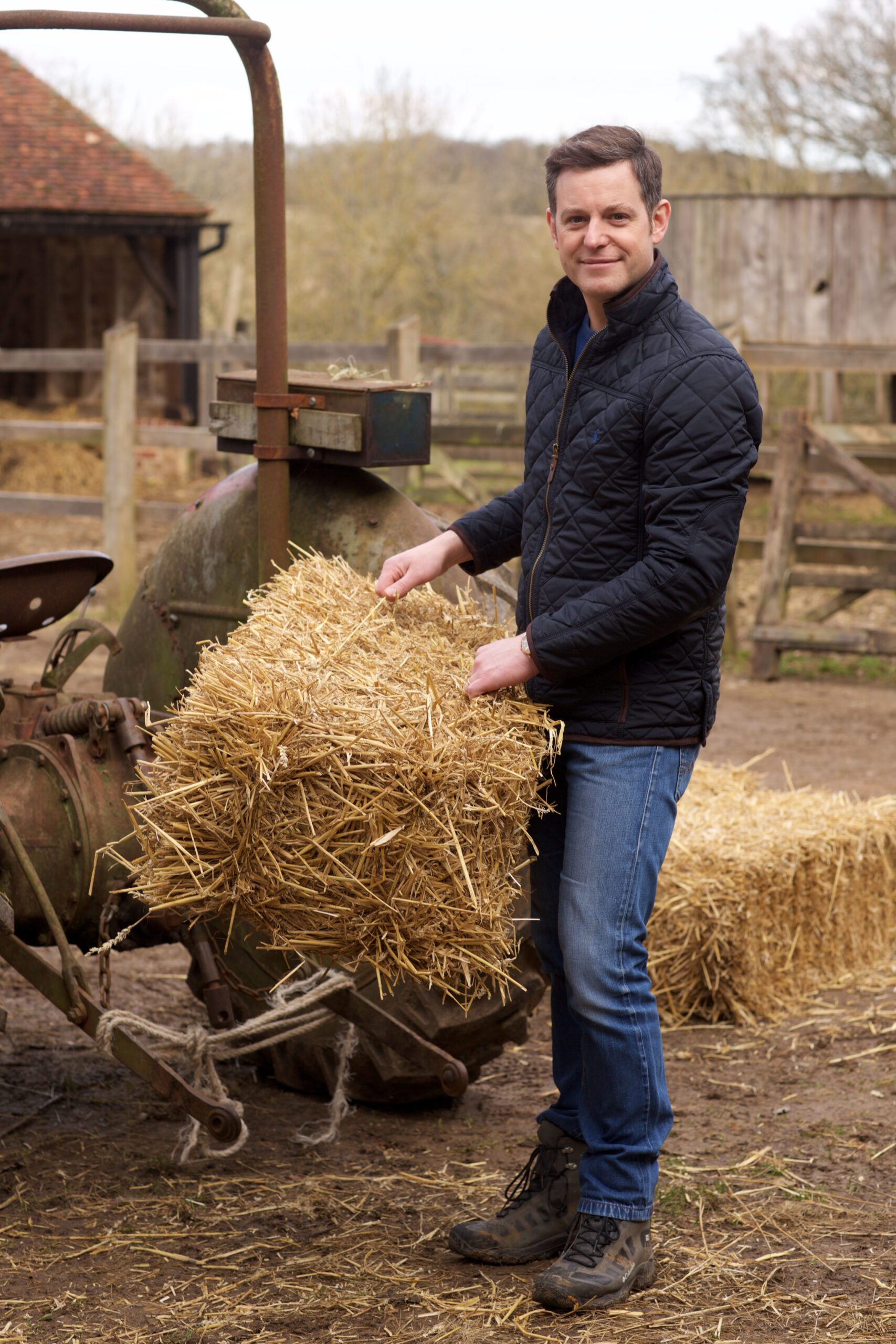 Matt Baker with a stack oh hay