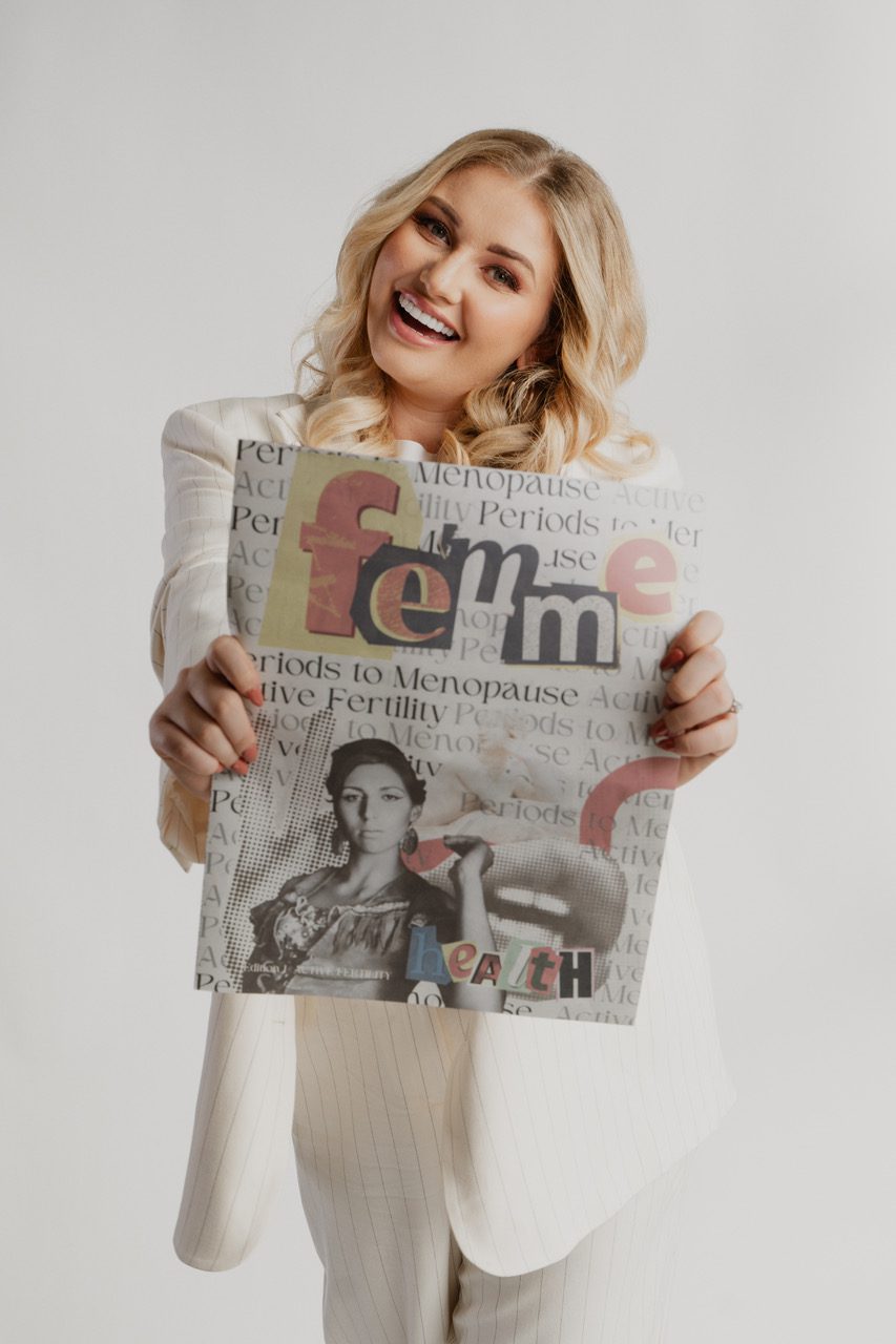 Amy Hart holding a newspaper