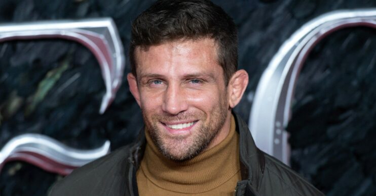 Alex Reid smiling at event