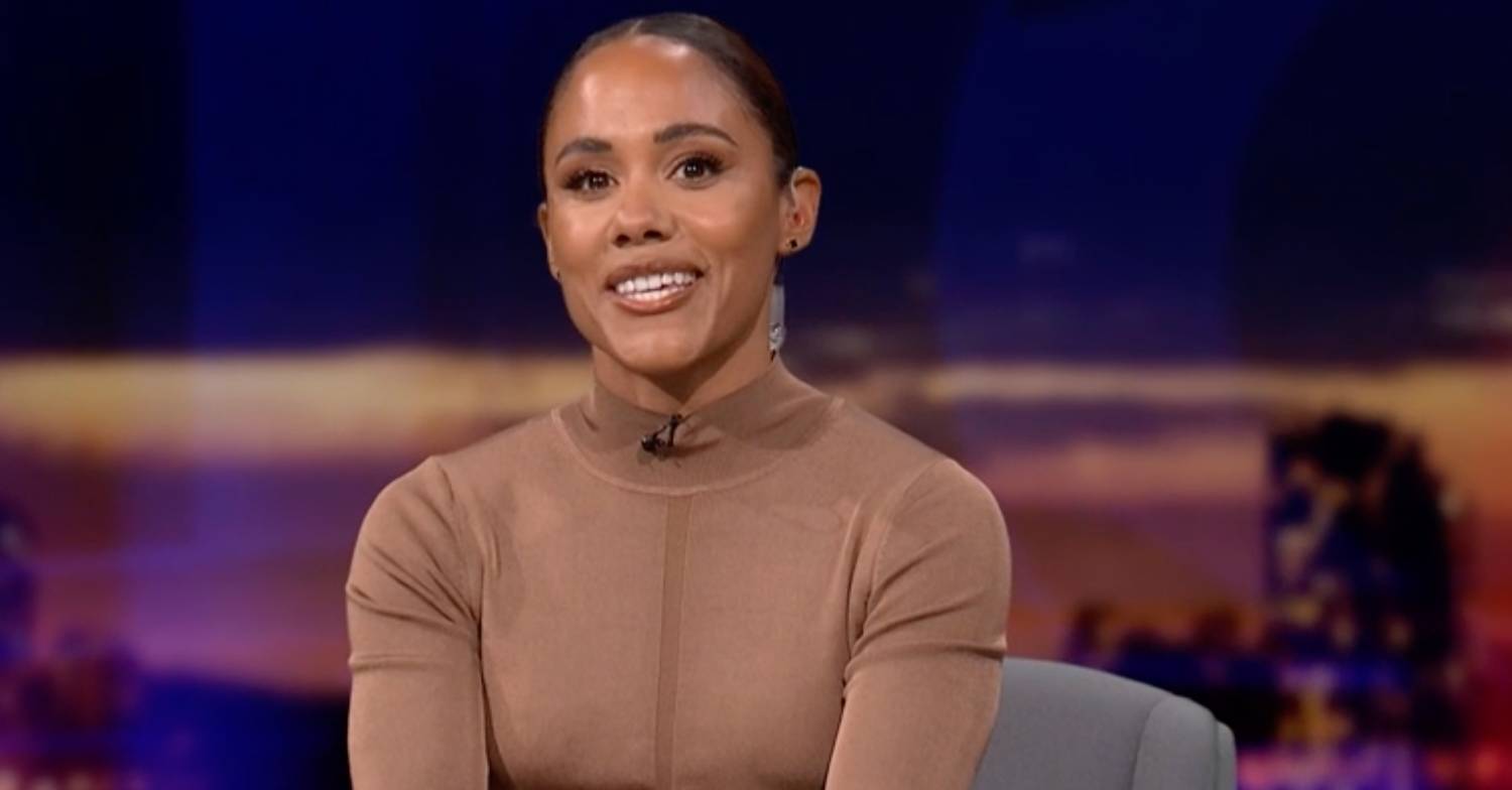 Alex Scott smiles