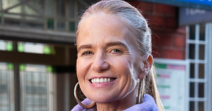 EastEnders returnee Bianca Jackson smiles outside Walford East station