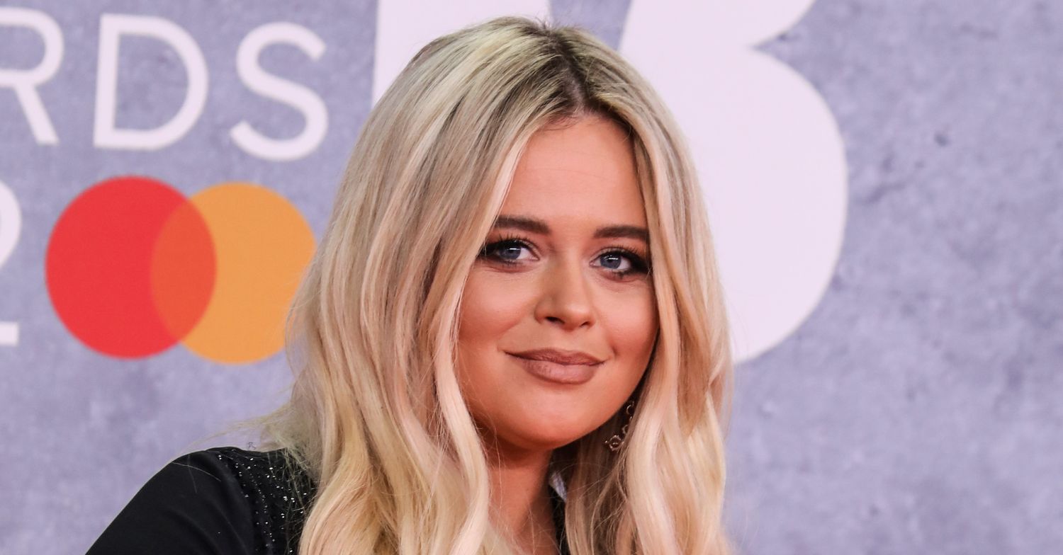 Emily Atack smiling on the red carpet