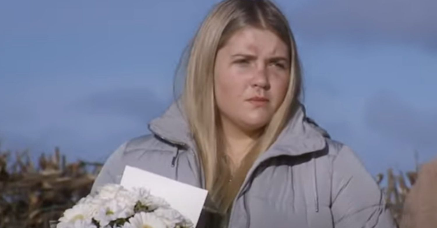 Emmerdale's Cathy is holding flowers