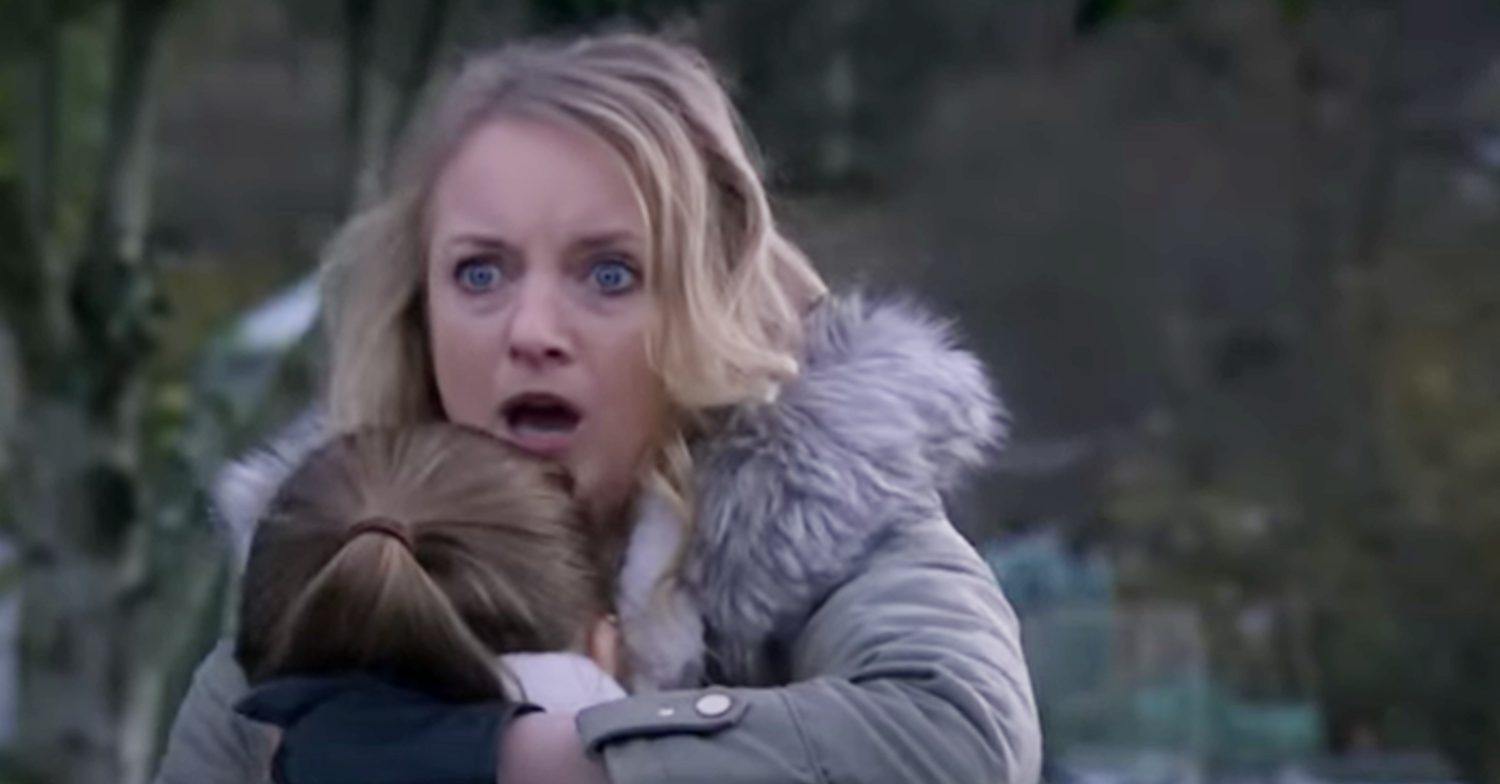 Emmerdale's Nicola is holding on to Angelica with her mouth open