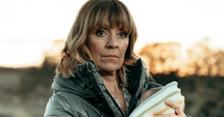 Rhona in Emmerdale clutches baby Ivy and look tense