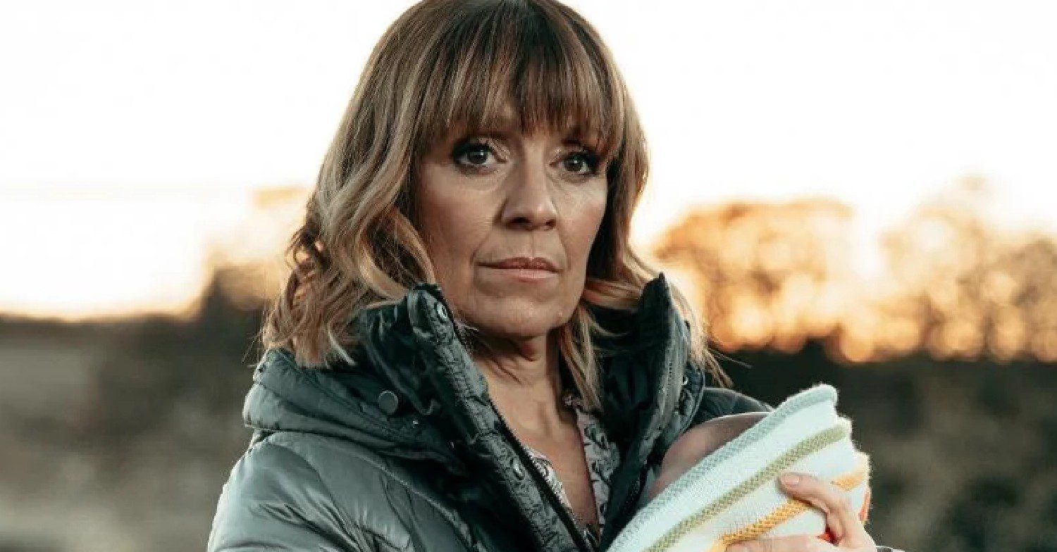 Rhona in Emmerdale clutches baby Ivy and look tense