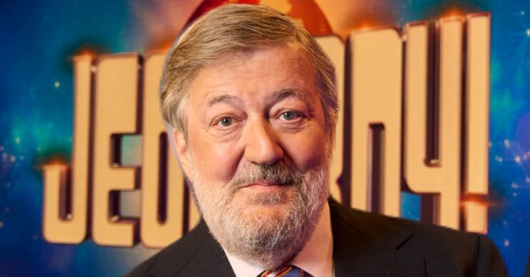 Close up of Stephen Fry in front of the Jeopardy! logo