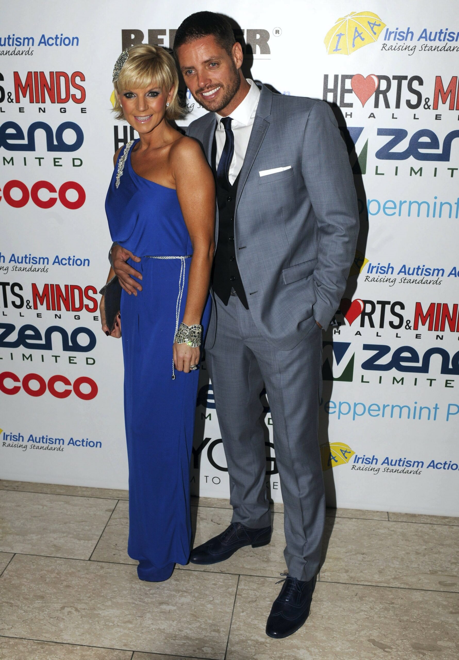 Keith Duffy smiling with wife Lisa Smith at event