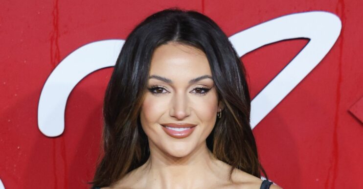 Michelle Keegan smiling on the red carpet