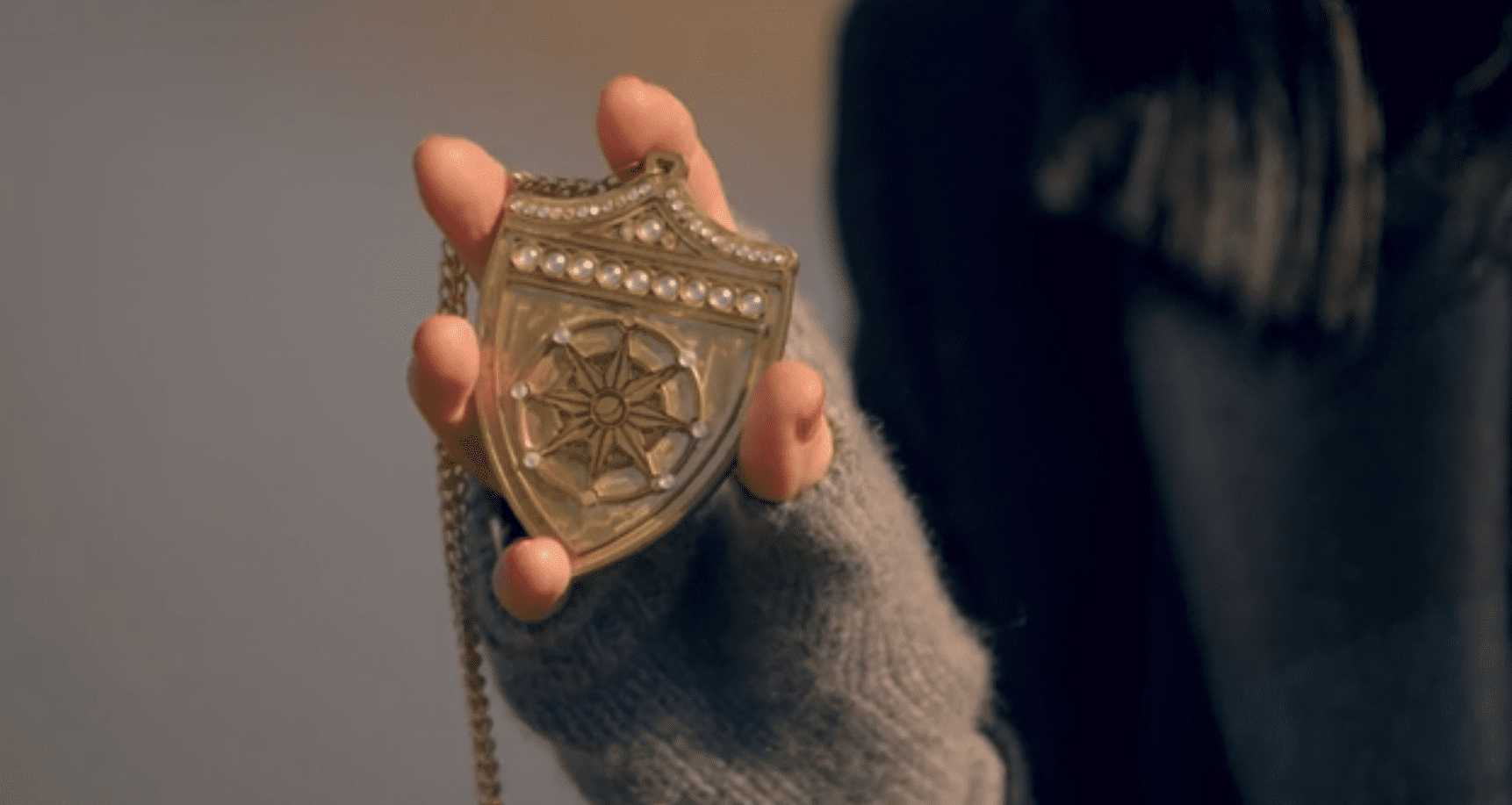 Claudia Winkleman holding a shield in The Traitors