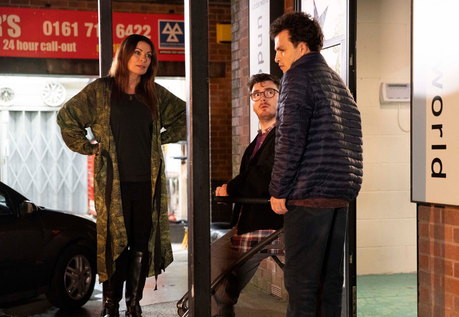 Coronation Street's Carla, Bobby and Simon are talking outside of the factory