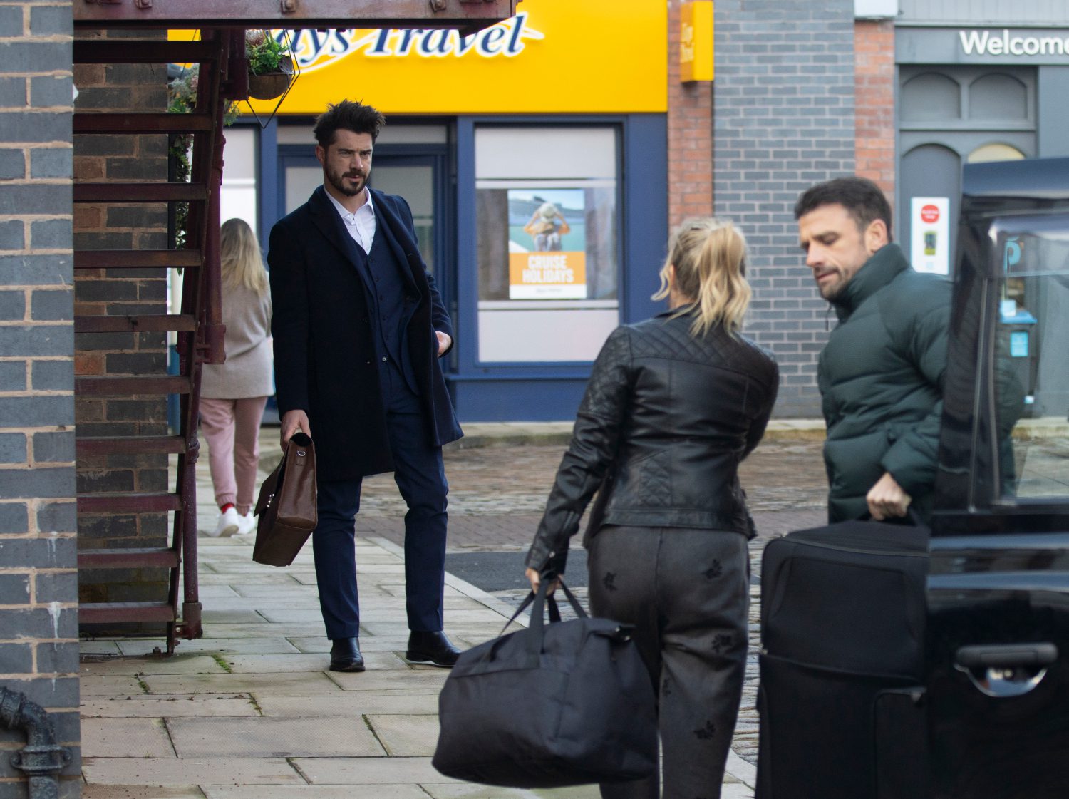 Coronation Street's Adam is watching Sarah and Damon move bags into the flat