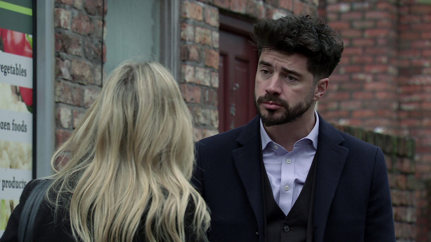 Adam looks at Sarah in Coronation Street looking tired and stressed