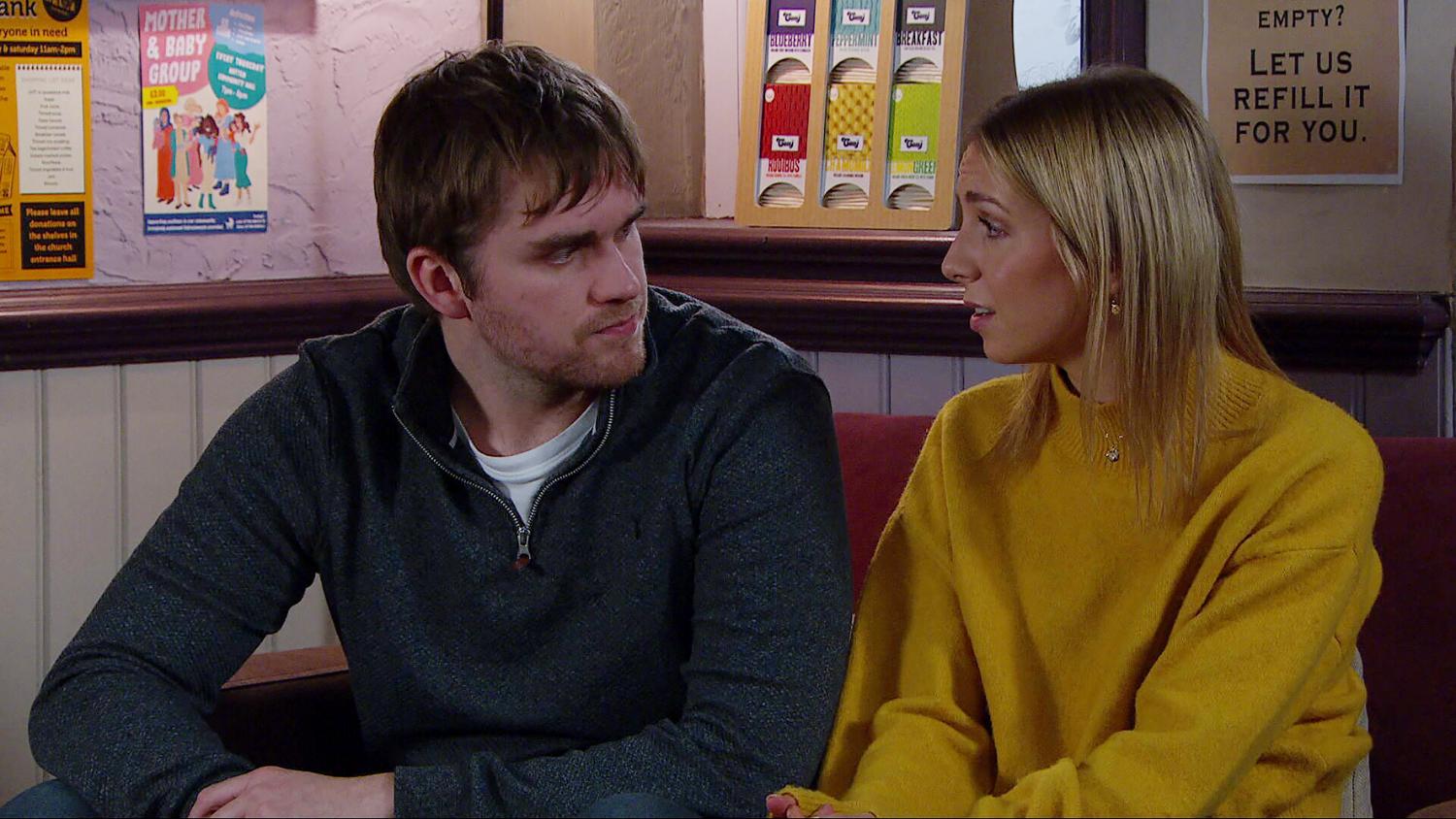 Tom King and Belle Dingle look tense in the cafe