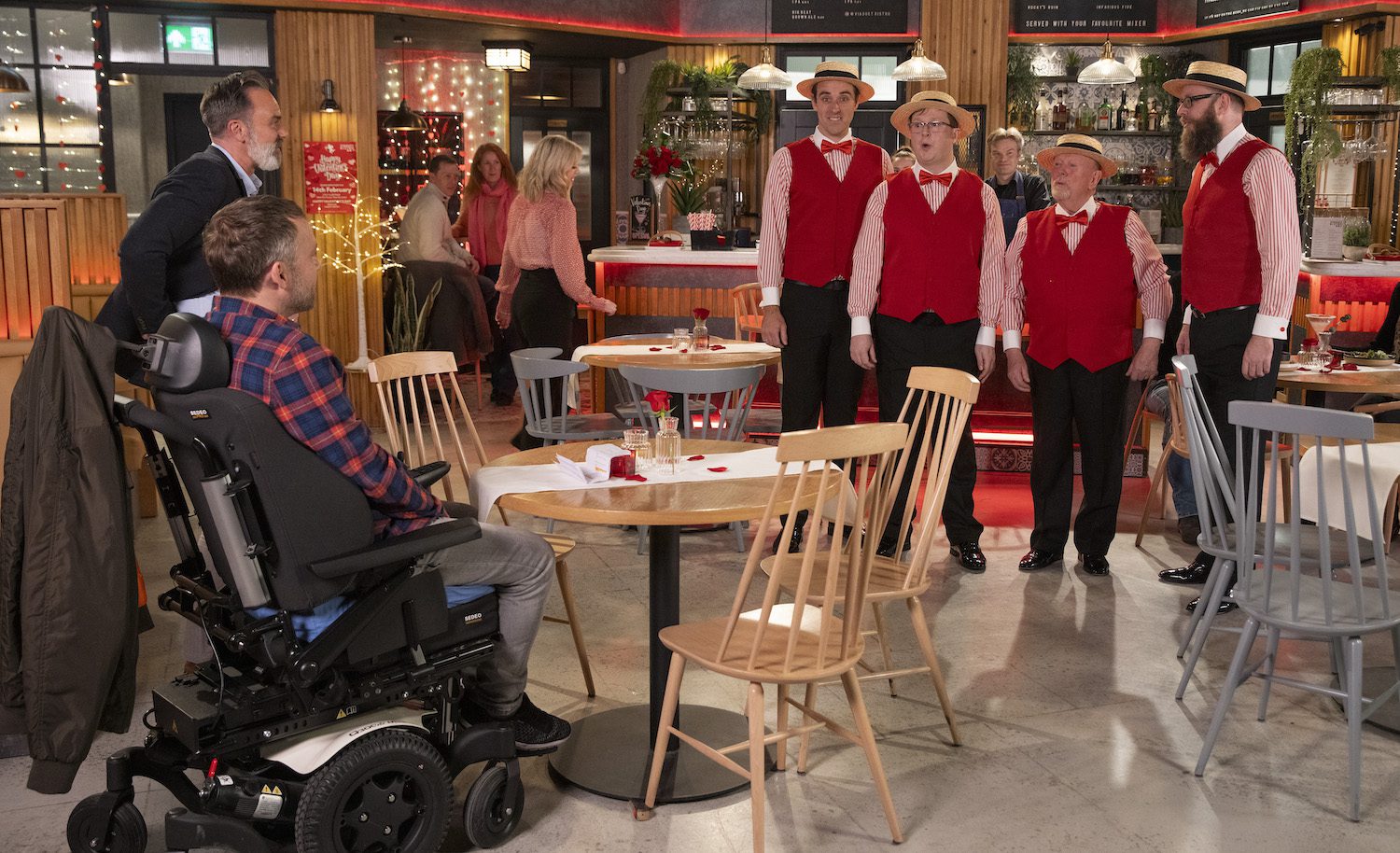 Billy surprises Paul with a Barbershop Quartet.