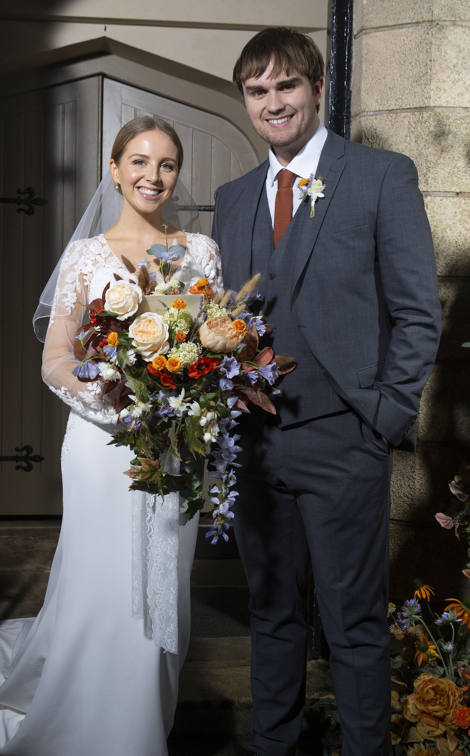 Smiling Tom and Belle in a wedding promo shot