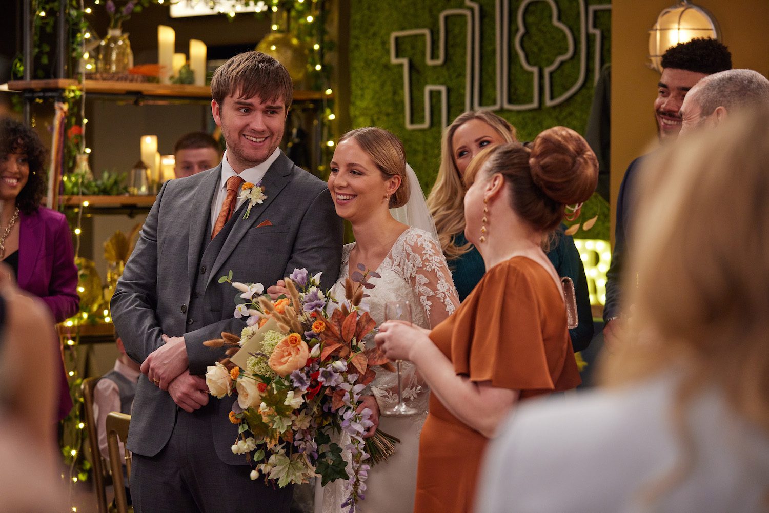 Emmerdale: Tom and Belle smile at their wedding reception