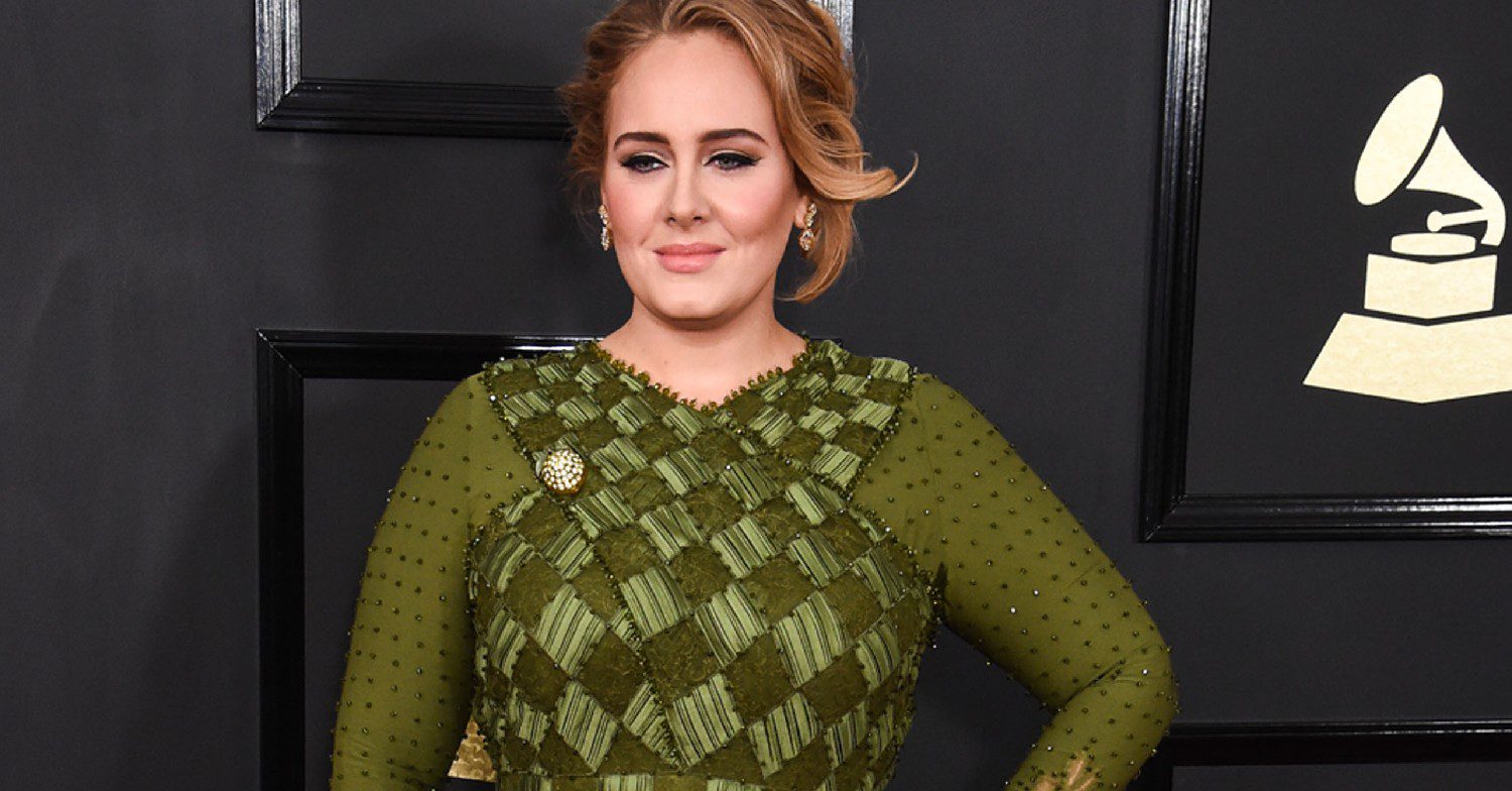 Adele posing on a red carpet 