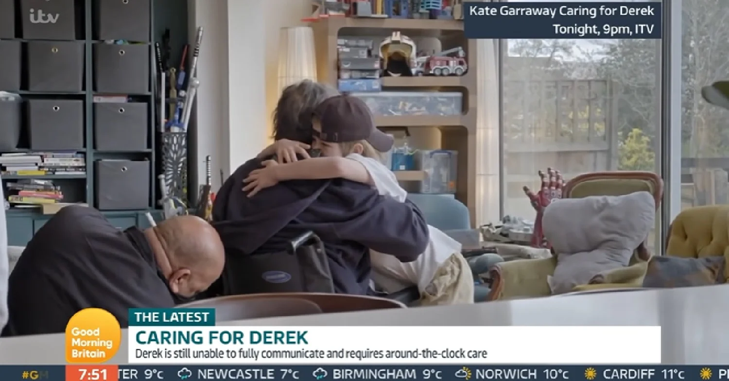 Derek Draper and Billy hug 