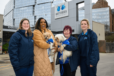 Alison Hammond outside Battersea Dogs Home with its staff