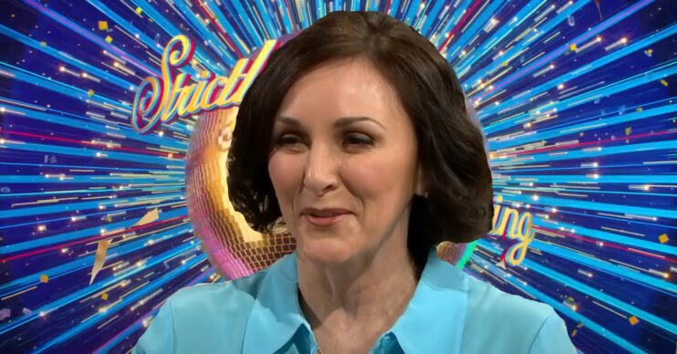 Shirley Ballas in front of Strictly logo