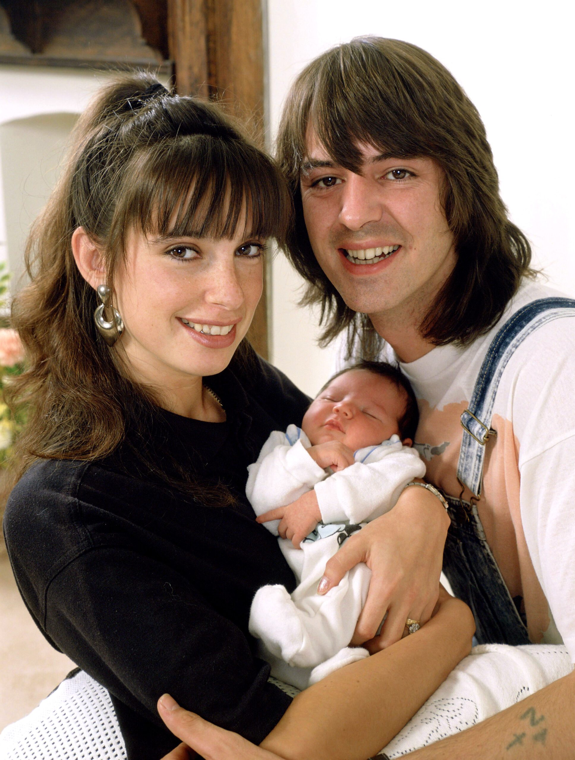 Amanda Noar and Neil Morrissey hold baby