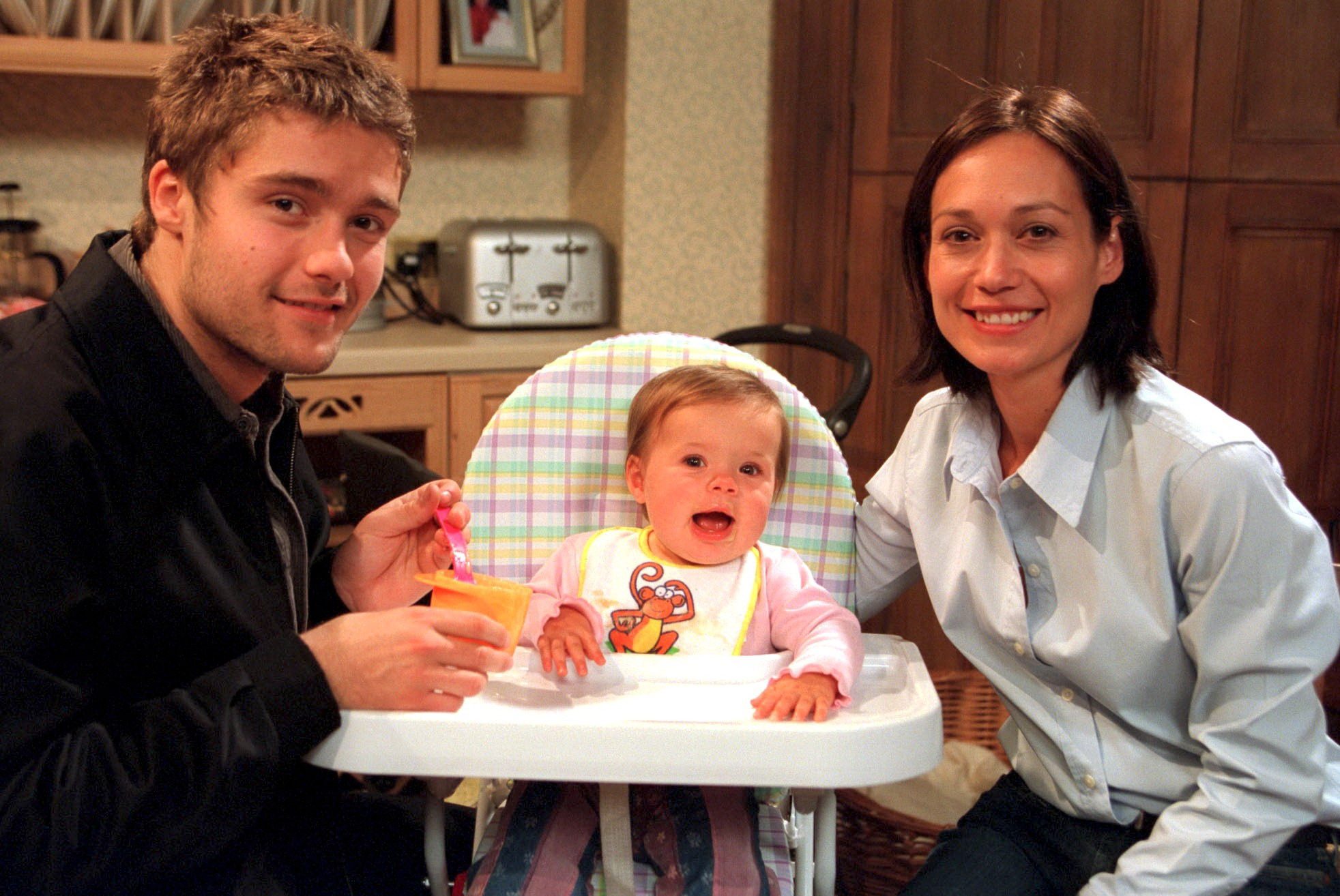 Emmerdale: Scott Windsor, Jean Tate and Zoe Tate post for a happy family shot while Jean sits in her highchair being fed