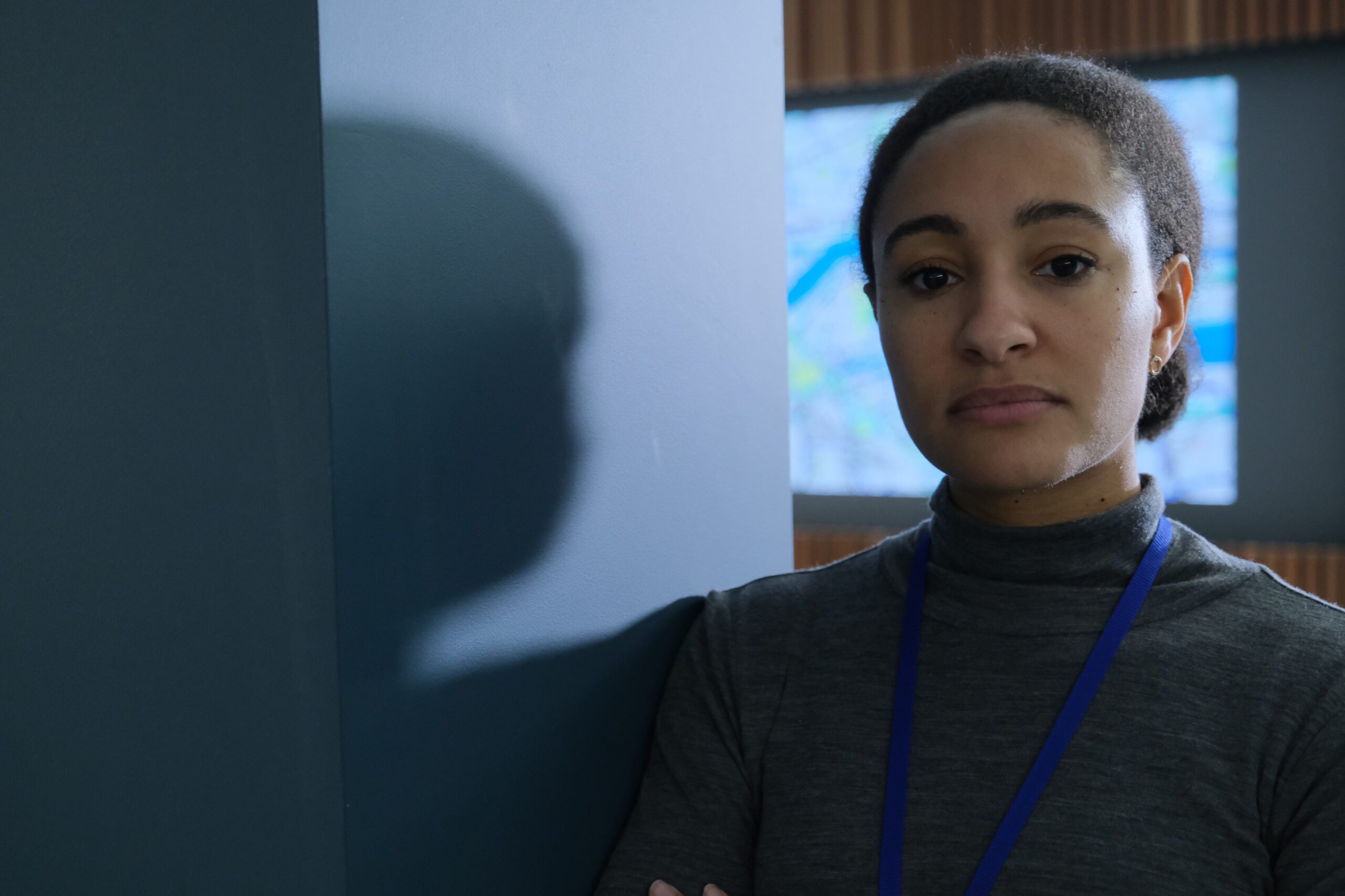 NATALIE SIMPSON as Helen leaning against a wall in Trigger Point 