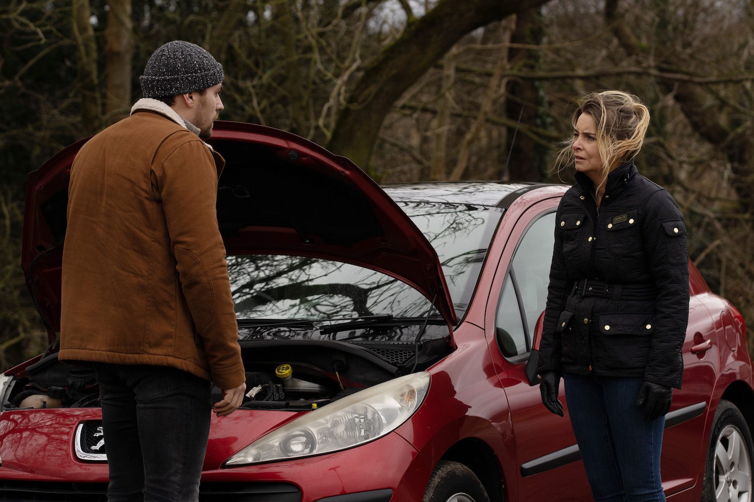 Emmerdale's Mack and Charity are talking outside of a broken down car