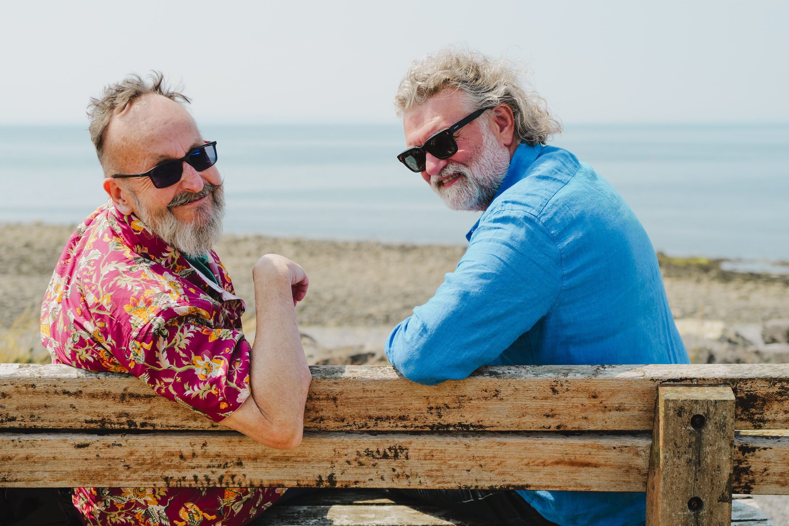 Dave Myers and Si King smiling on the beach