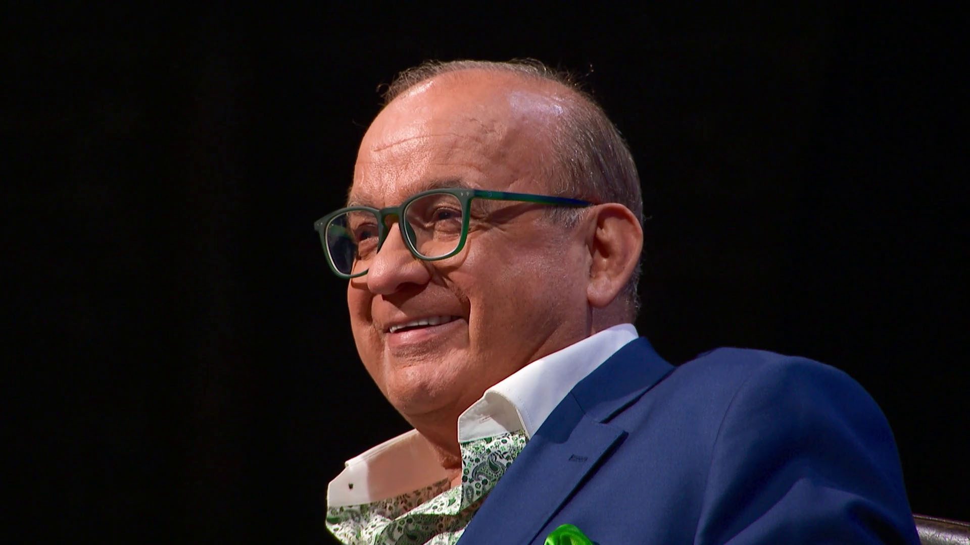 Touker Suleyman smiling at a pitch on Dragons' Den