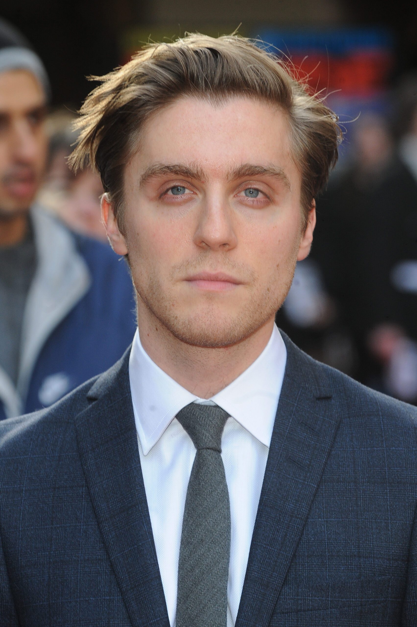Jack Farthing with short hair in a suit and tie on the red carpet for The Jameson Empire Awards 2015