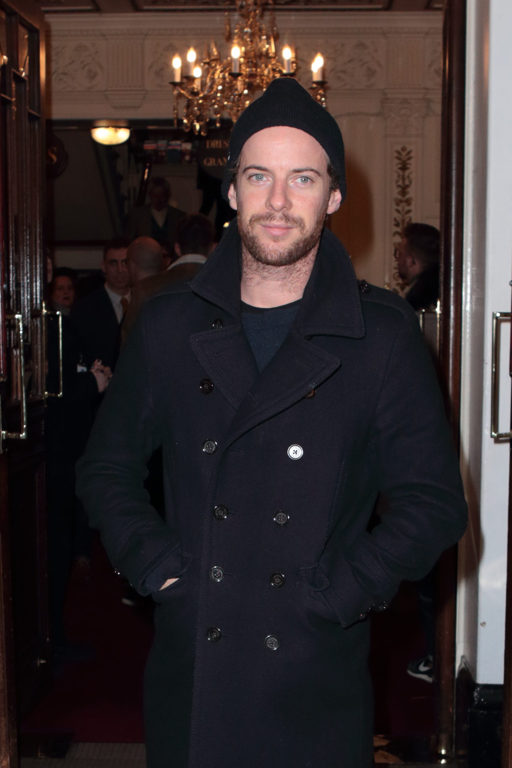 Luke Treadaway wearing an all black ensemble including a hat and double breasted jacket as he left the True West Press Night