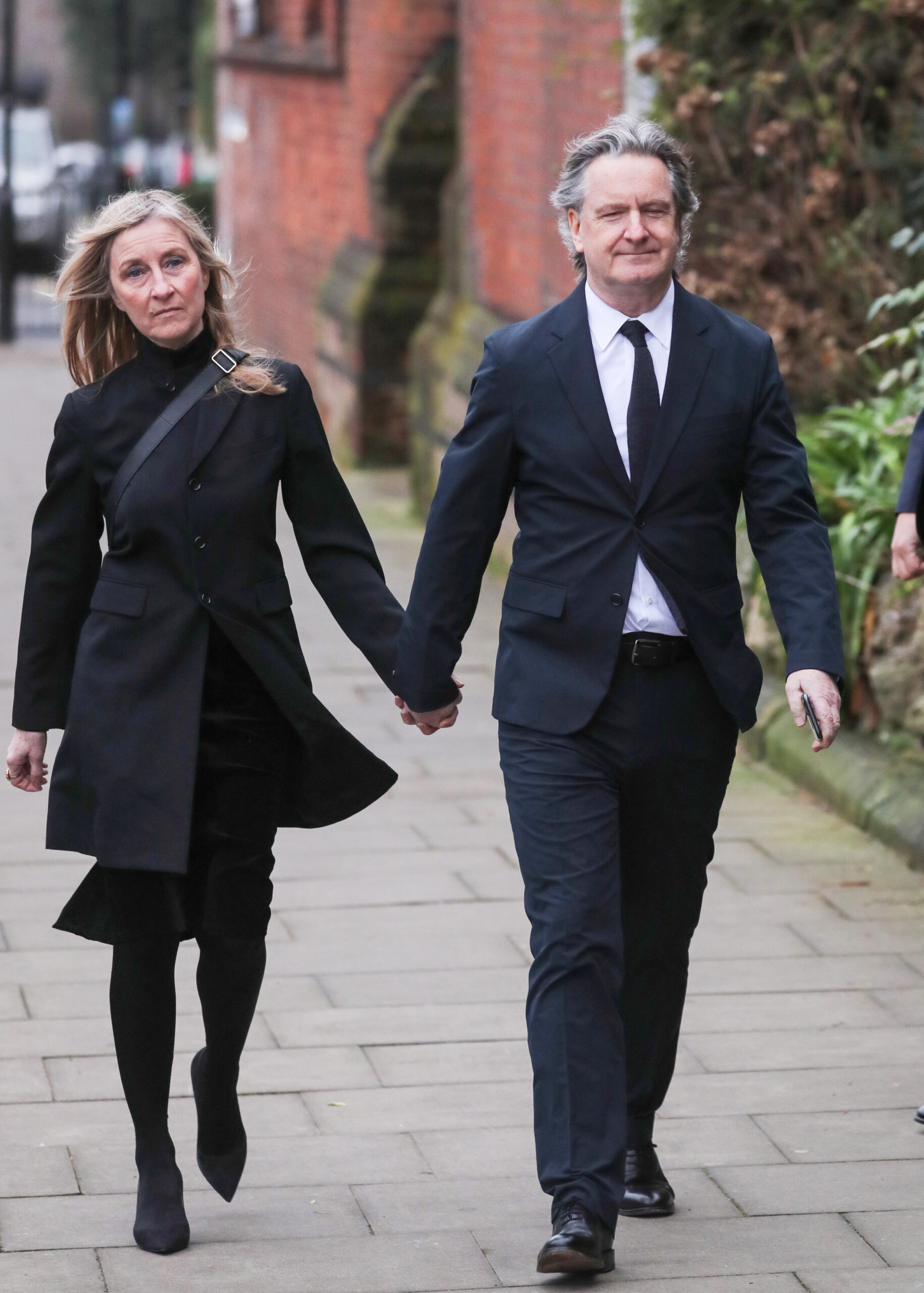 Fiona Phillips and Martin Frizzel arrive at Derek Draper's funeral