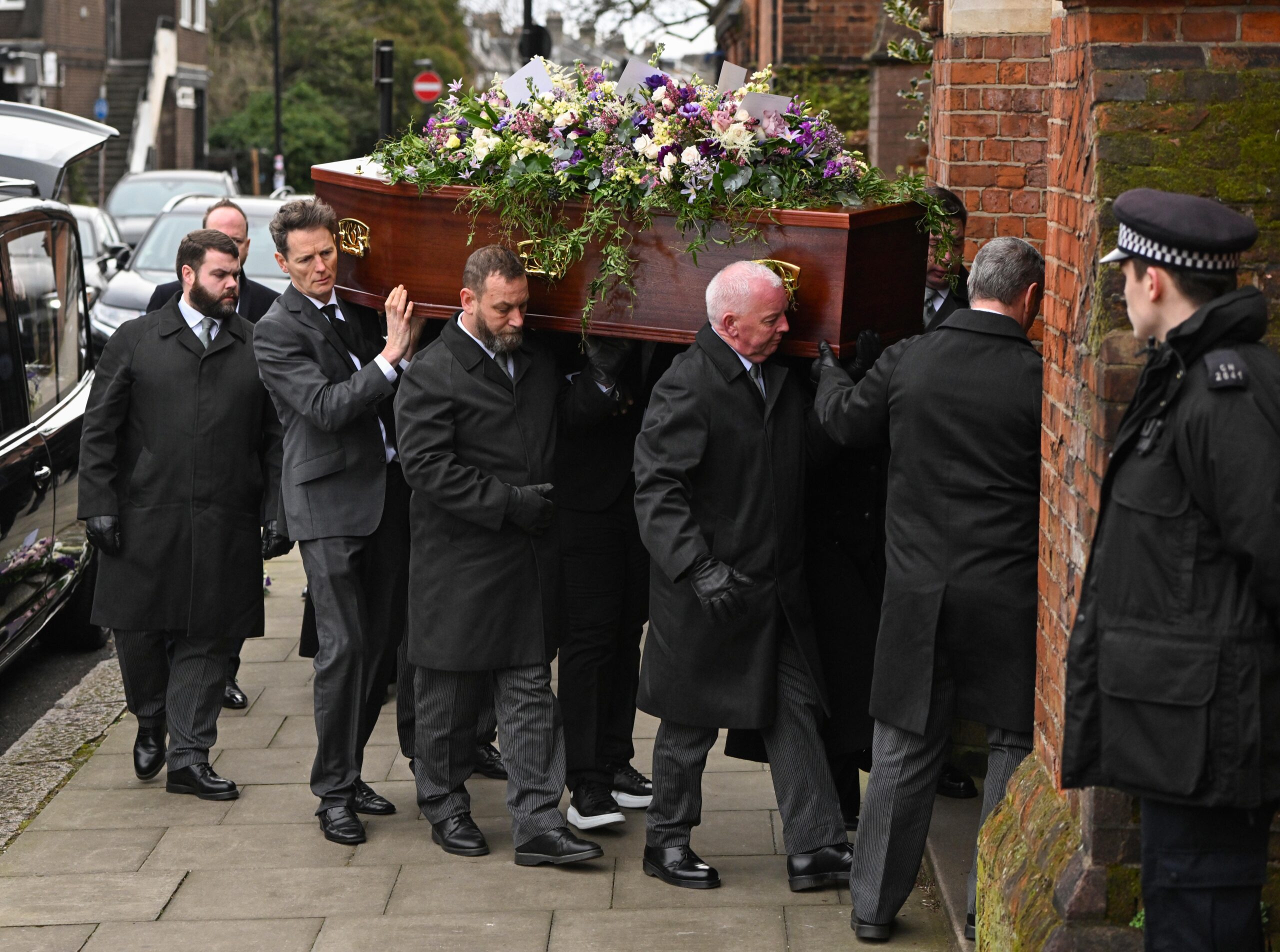 Derek Draper's coffin carried into church