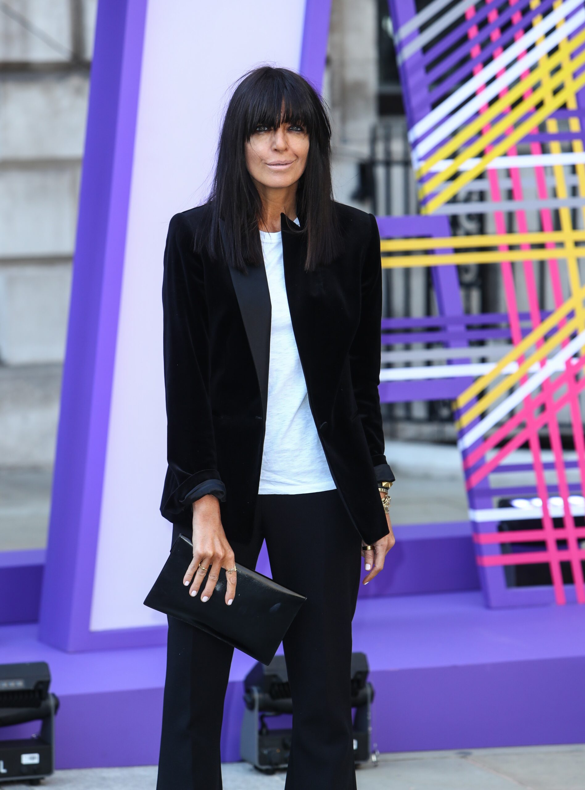 Claudia Winkleman posing at event with fringe