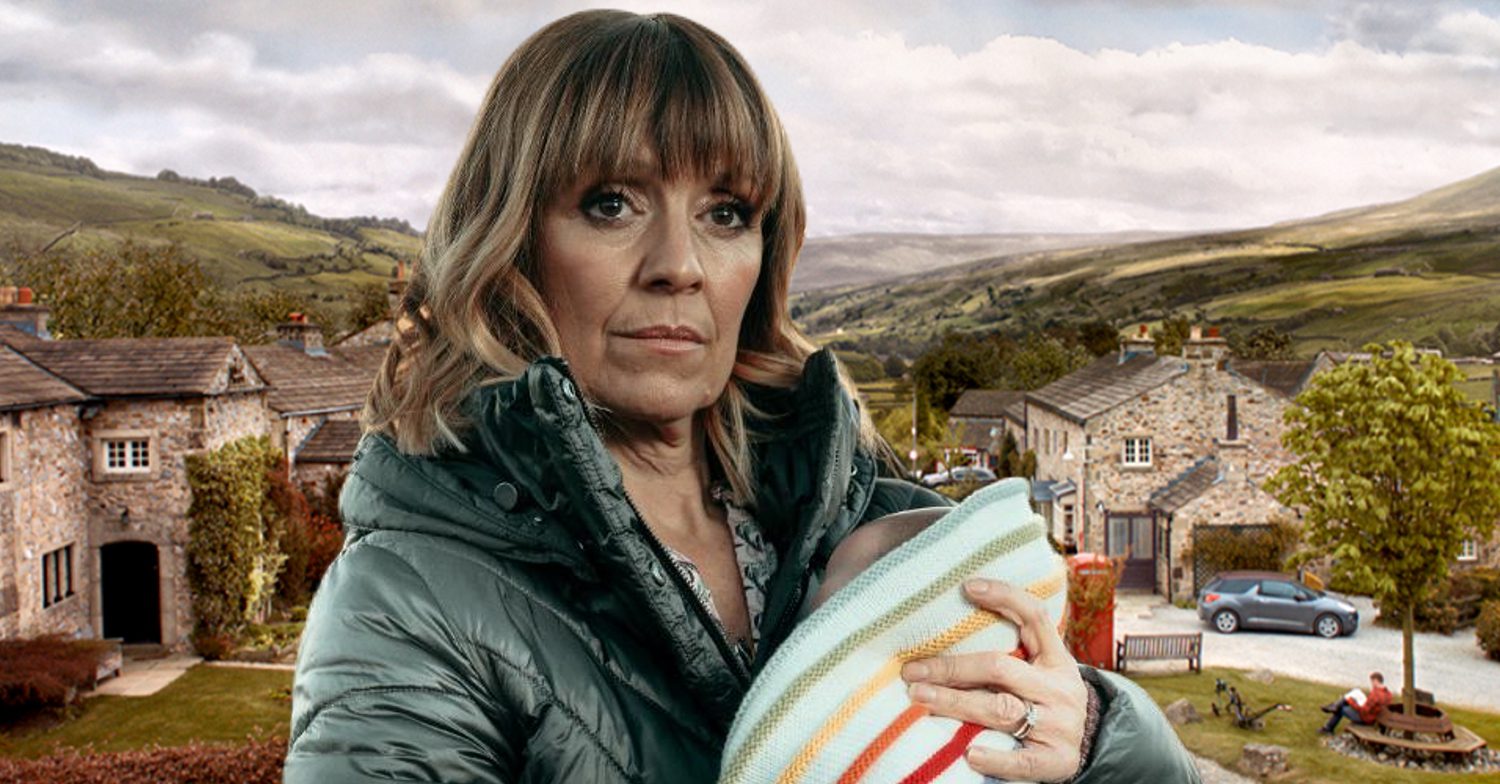 Emmerdale's Rhona is holding baby Ivy, the background of the Dales