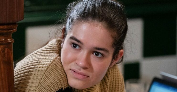 EastEnders: Jade looks suspicious as she peers round the corner (Credit: BBC)