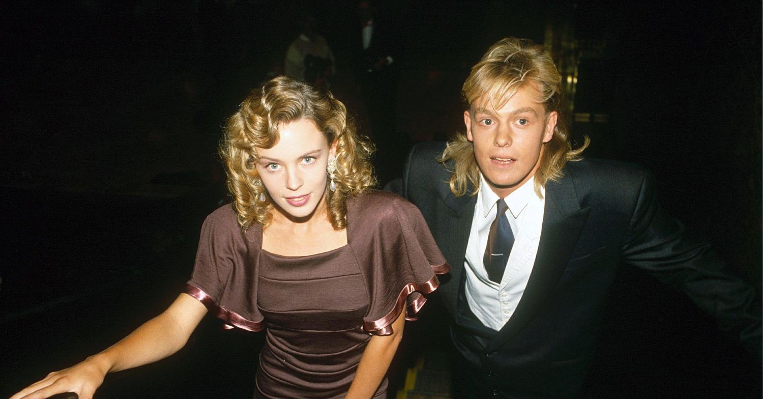 Kylie Minogue and Jason Donovan looking up