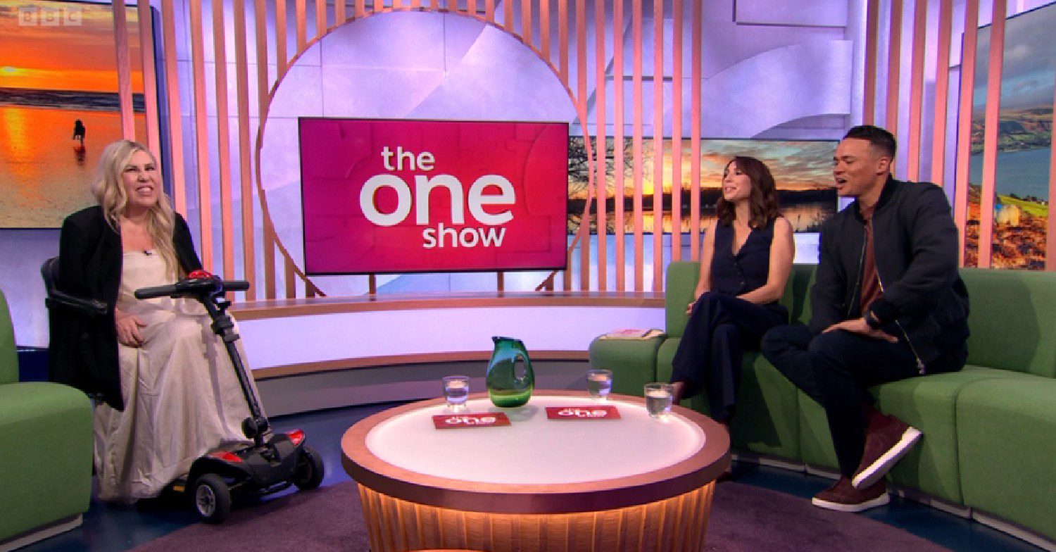 Nikki Jones smiling alongside Alex Jones and Jermaine Jenas on The One Show