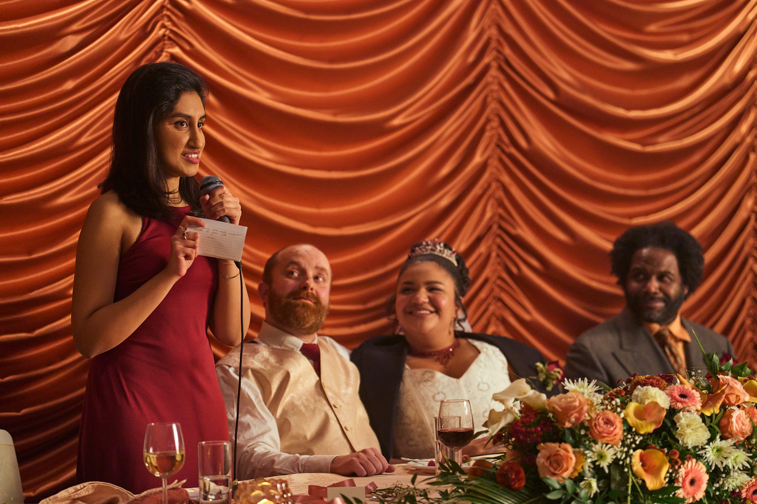 Emma (Ambika Mod) gives a speech at Tilly (Amber Grappy) and Graham's (Adam Loxley) wedding in One Day
