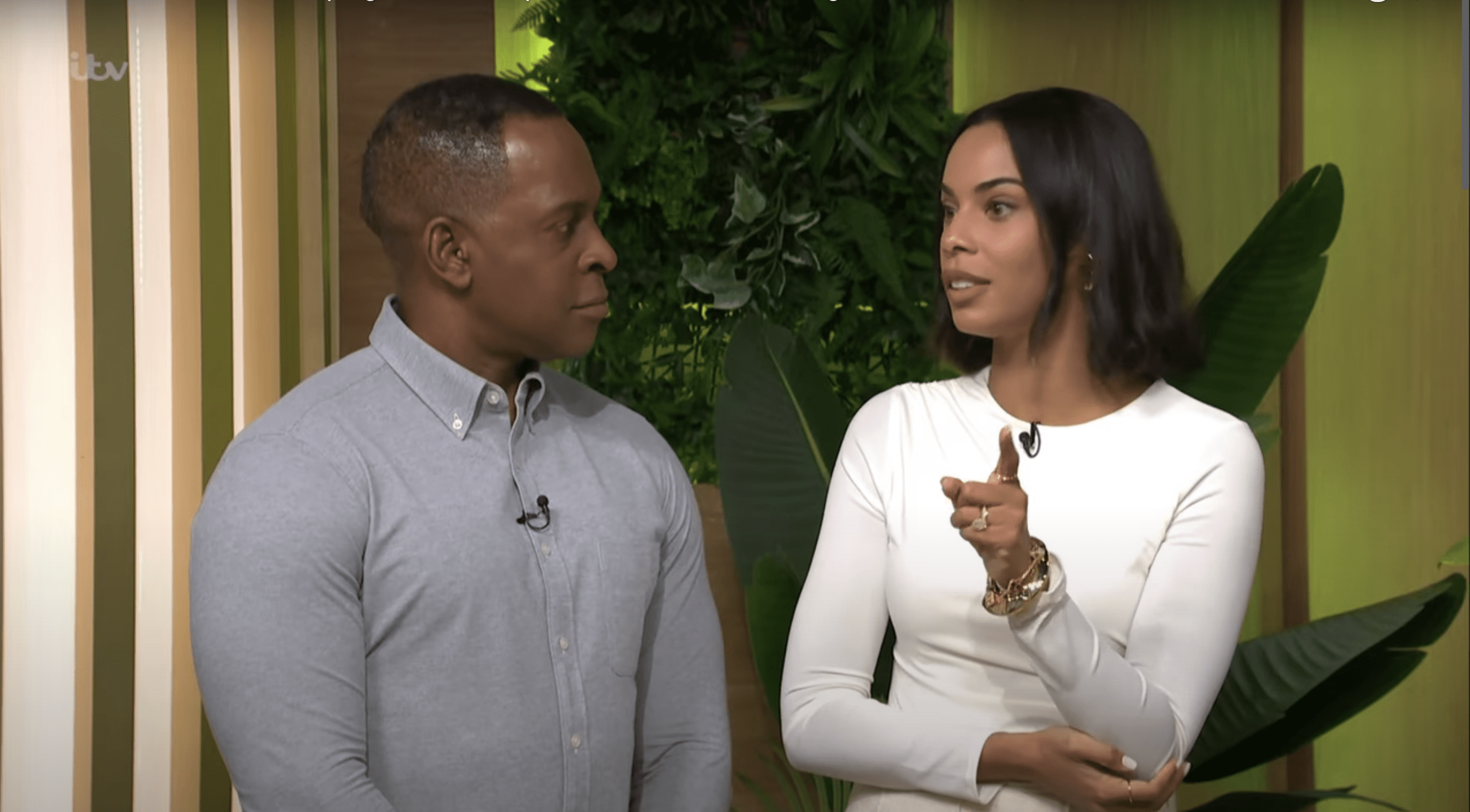 Rochelle Humes in a white dress and Andi Peters in a grey shirt, facing each-other whilst discussing house plants on This Morning 
