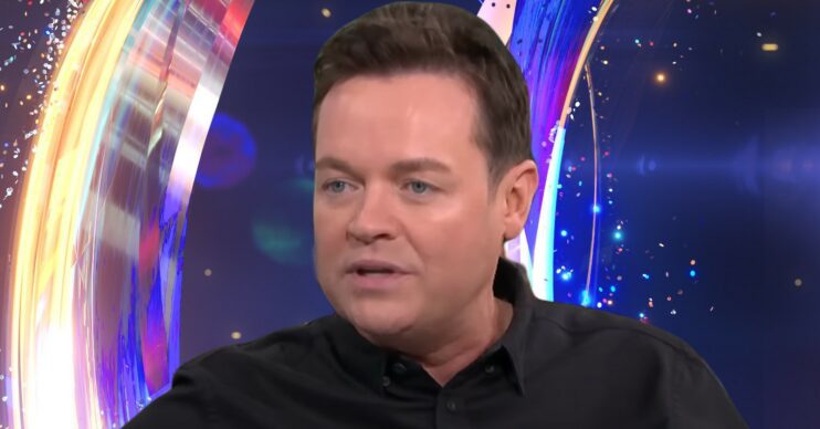 Stephen Mulhern in front of Dancing On Ice logo