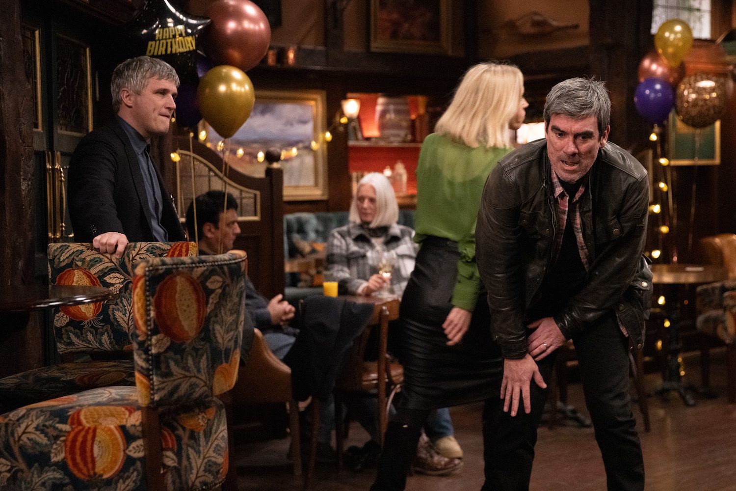 Cain doubled over in pain in the Woolpack on Emmerdale